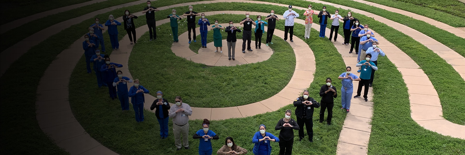 Texas Health Alliance Staff Forming Heart in the Garden